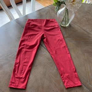Like new Zyia dark red Capri with pockets on both sides. Sz 6-8